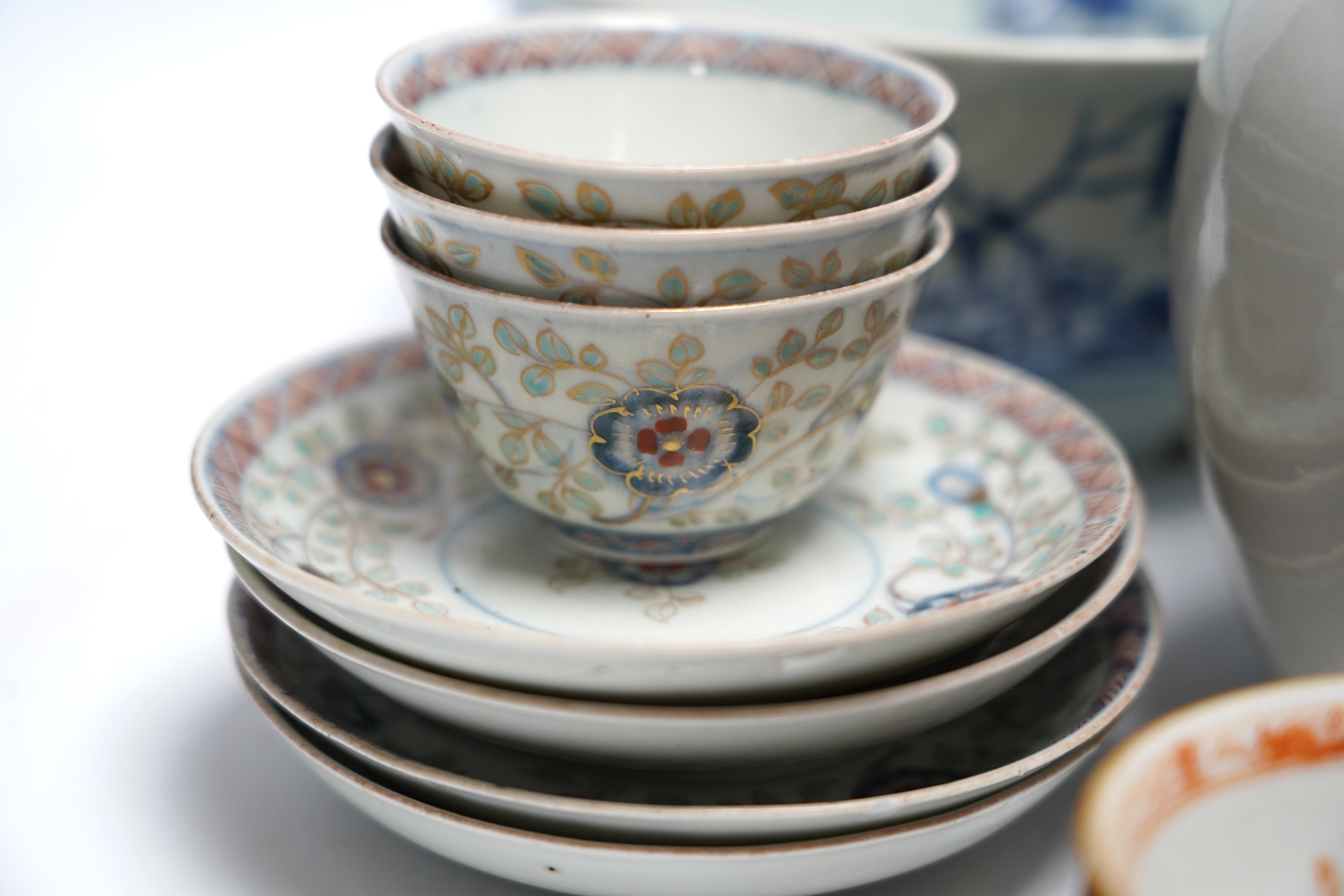 A group of 18th century Chinese and Japanese porcelain including blue and white bowls and jar with hardwood cover, largest 19cm in diameter